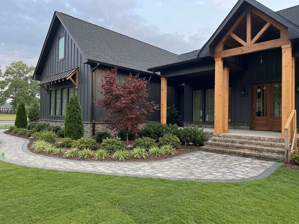 Modern farmhouse with Japanese maple, layered beds and paver walk